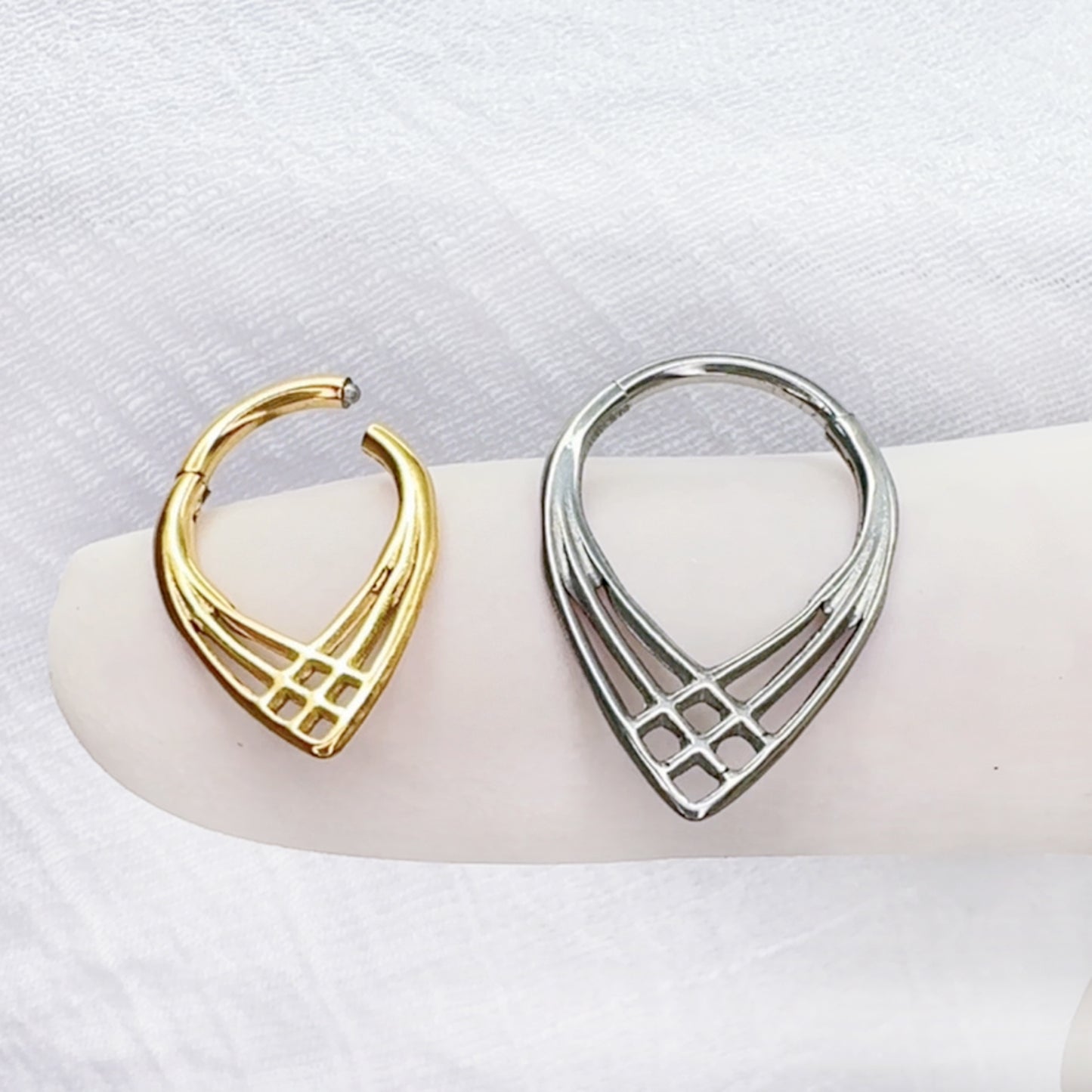 Titanium hinged hoop with chevron arrow design for septum and daith piercing