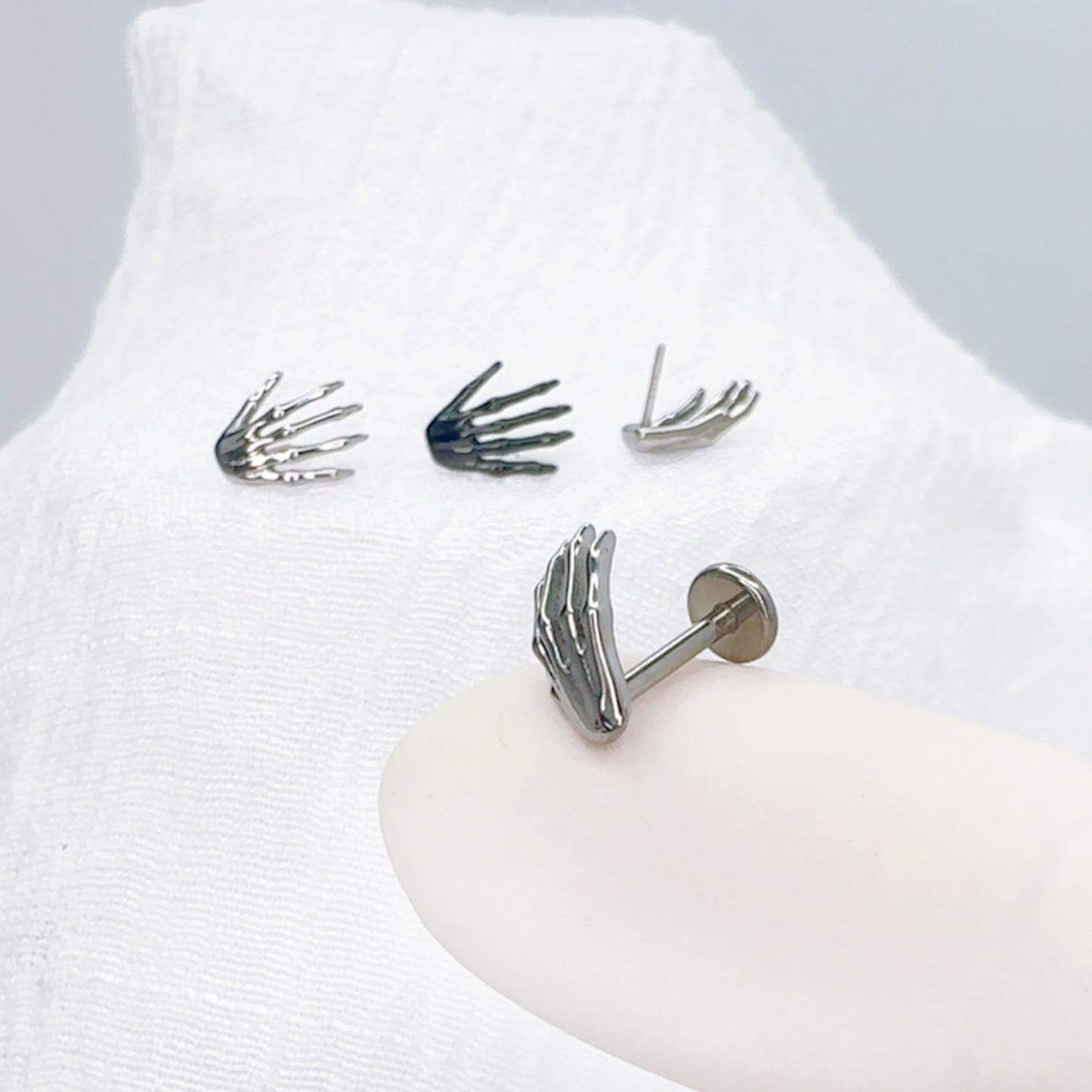 ✨ Titanium Skeleton Hand Top Threadless Labret