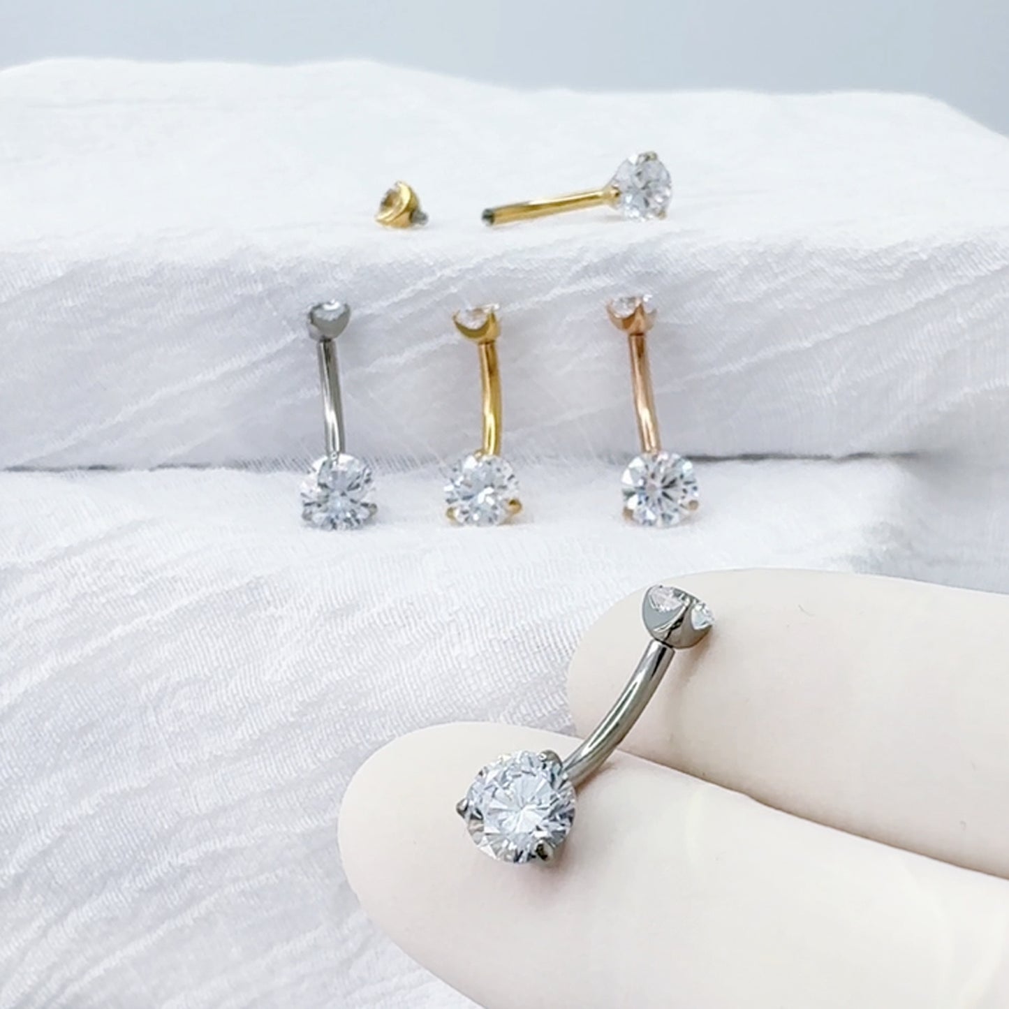 Titanium prong-set CZ belly button ring curved barbell