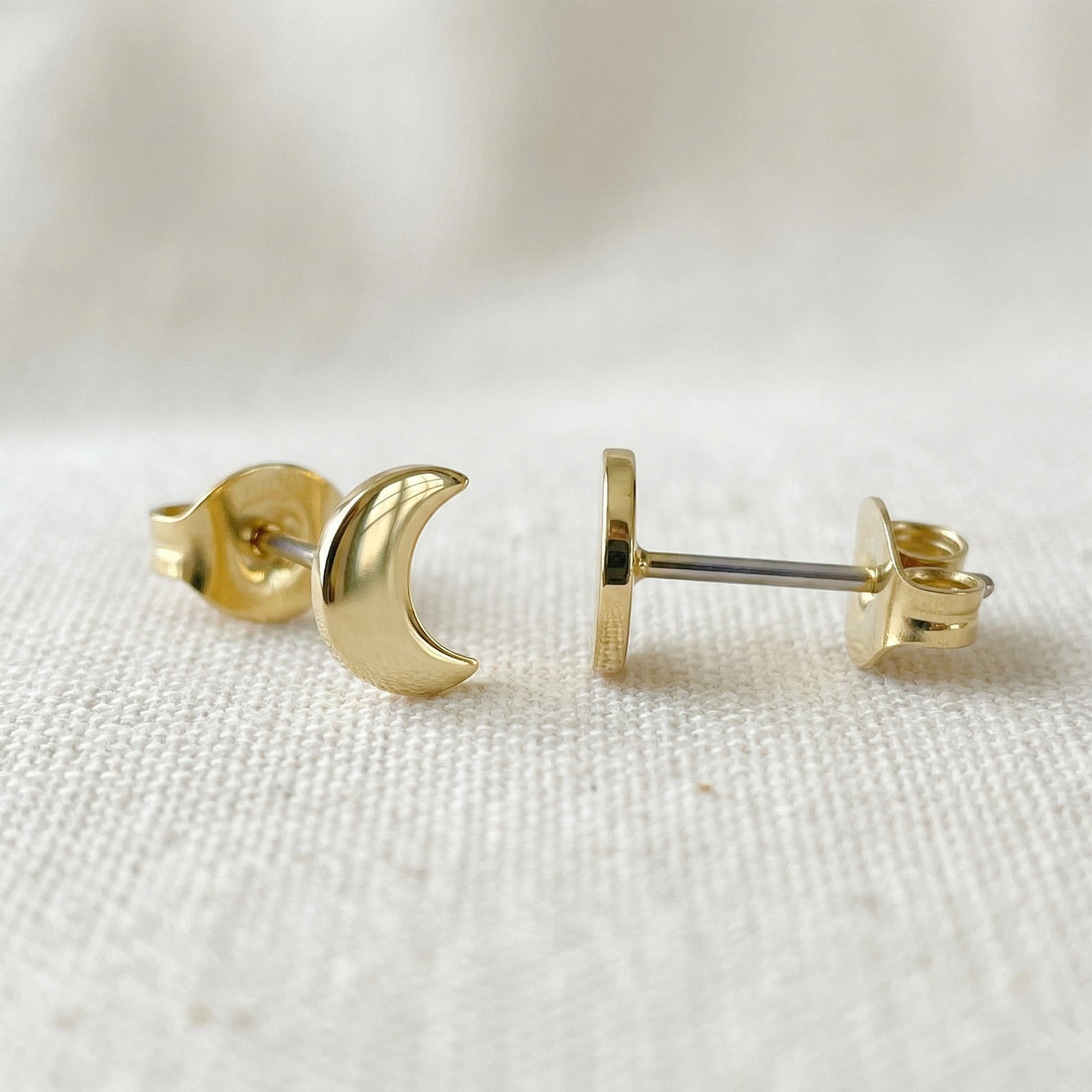 Gold titanium crescent moon stud earrings front and side profile view