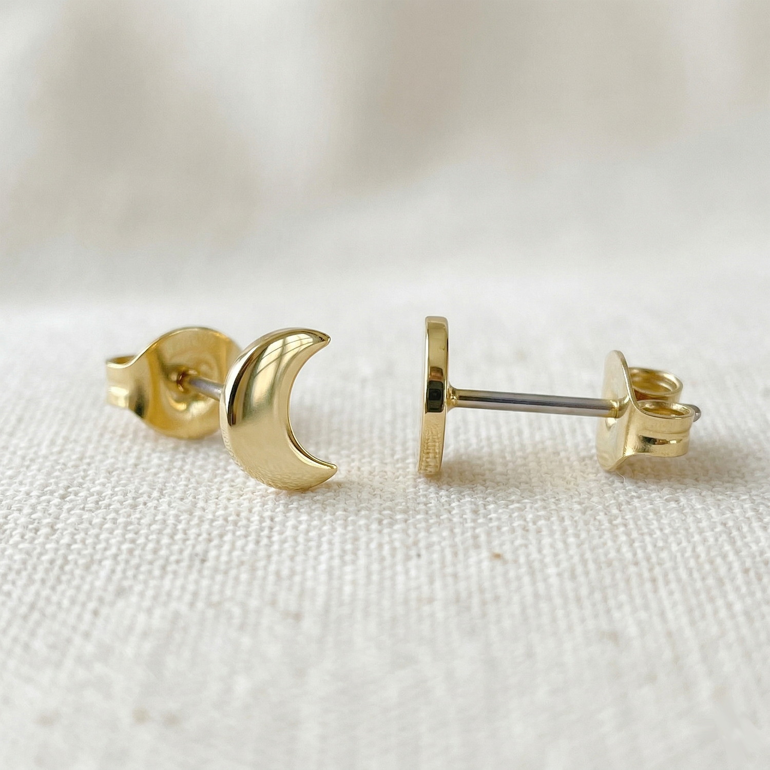 Gold titanium crescent moon stud earrings front and side profile view