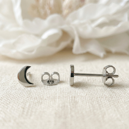 Silver titanium crescent moon stud earrings front and side profile view