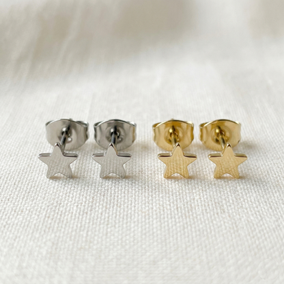 Silver and gold titanium star stud earrings side by side comparison