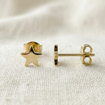 Gold titanium star stud earrings front and side profile view