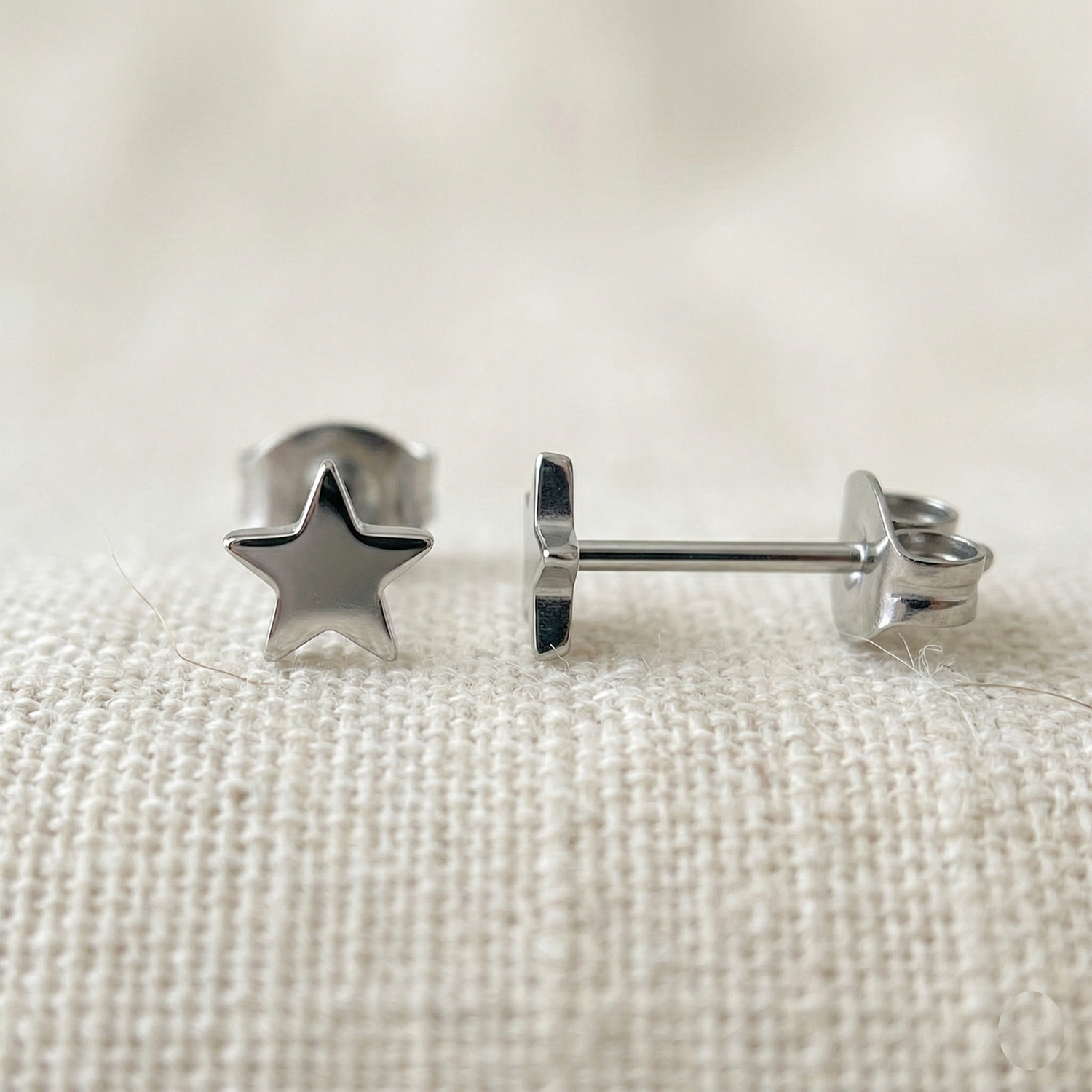 Silver titanium star stud earrings front and side profile view