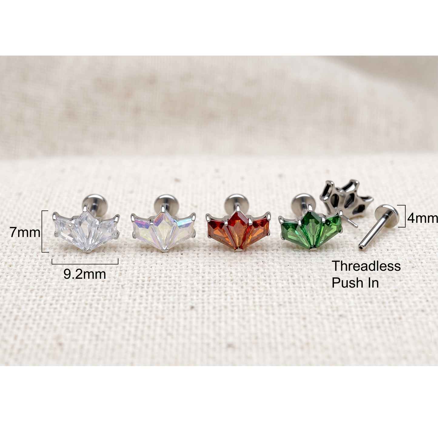 Set of five earrings with measurements on a white fabric background