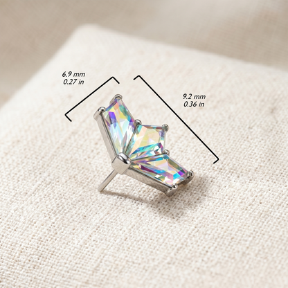 Crystal earring on a textured surface with measurements indicated