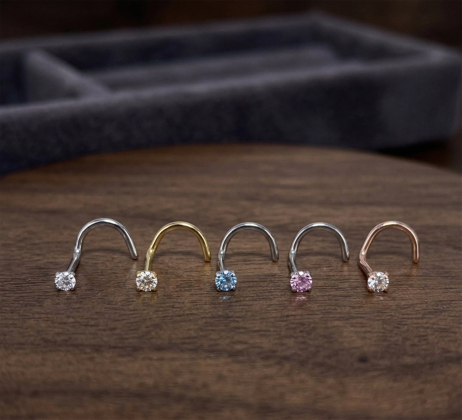 CZ nose screw rings in 5 colors showing clear gold pink aqua rose gold