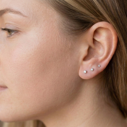 Pink CZ bezel stud shown on ear with lobe piercing