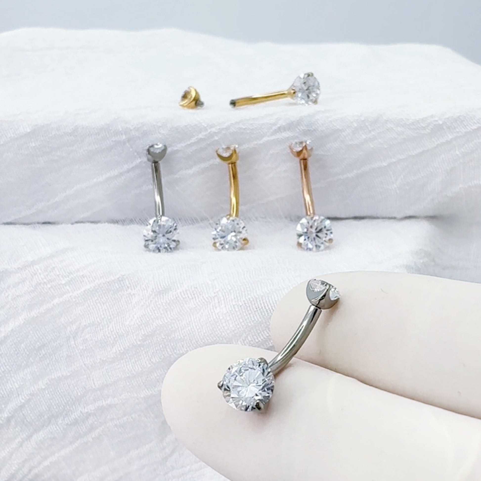 Titanium prong-set CZ belly button ring curved barbell
