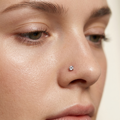 Clear CZ nose stud close-up on nostril piercing