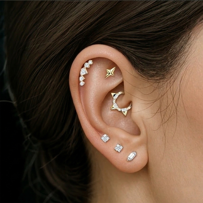 Silver titanium CZ spike hinged hoop shown in daith piercing