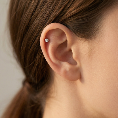 Silver titanium bezel CZ convex threaded labret shown on helix