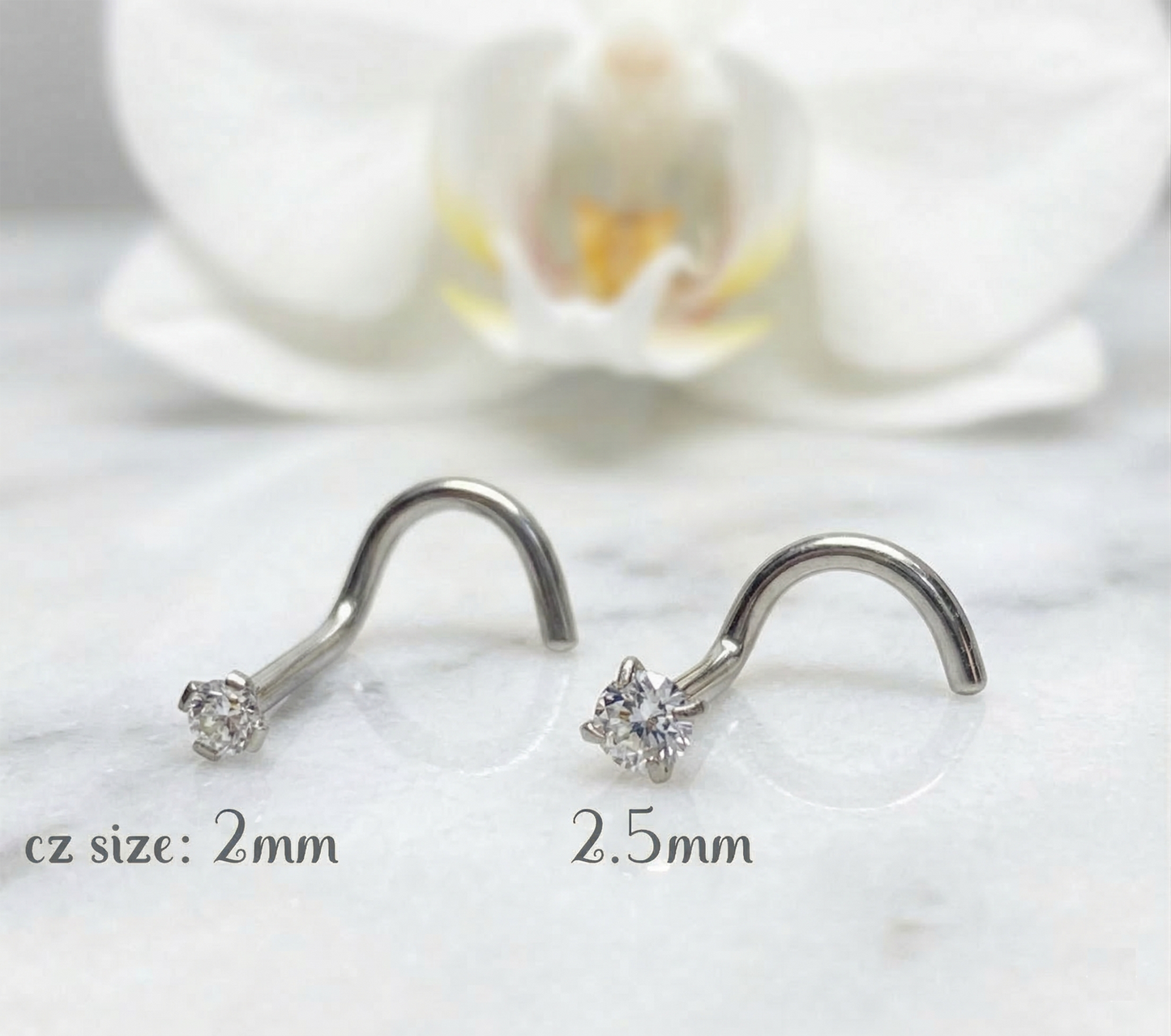 Titanium CZ nose corkscrew studs showing 2mm and 2.5mm size comparison