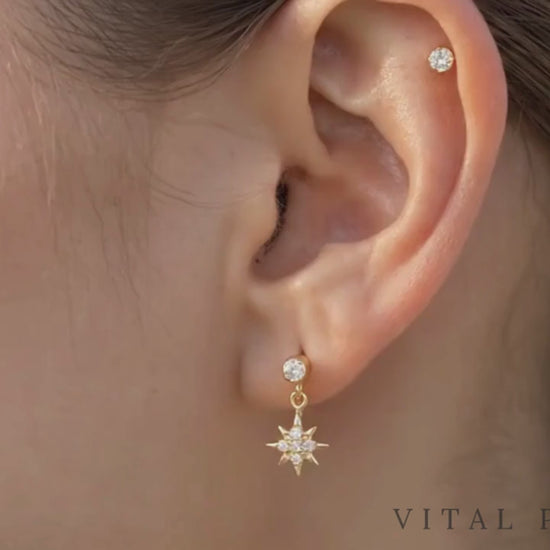 Titanium north star dangle stud video shown on ear

