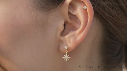 Titanium north star dangle stud video shown on ear
