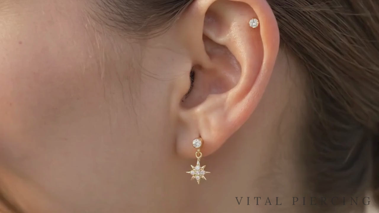 Titanium north star dangle stud video shown on ear
