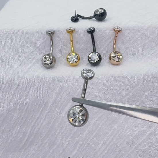 Titanium push-in belly button ring with round bezel-set CZ top

