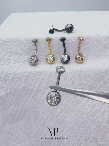 Titanium push-in belly button ring with round bezel-set CZ top
