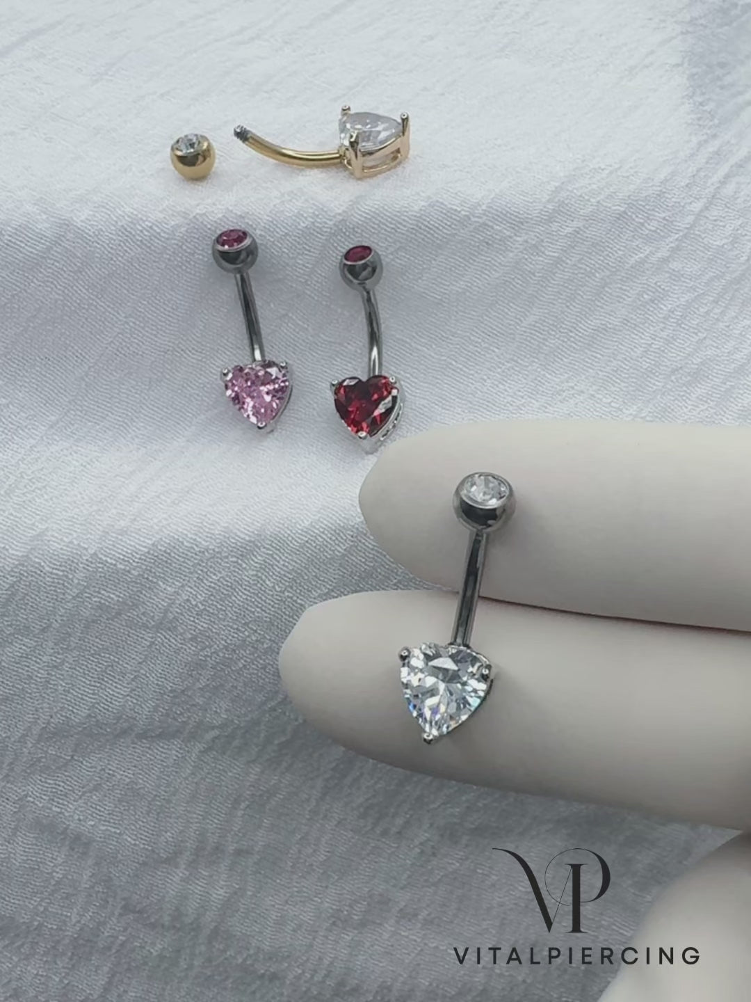 Titanium belly ring with CZ top and heart-shaped brass prong CZ for navel piercing