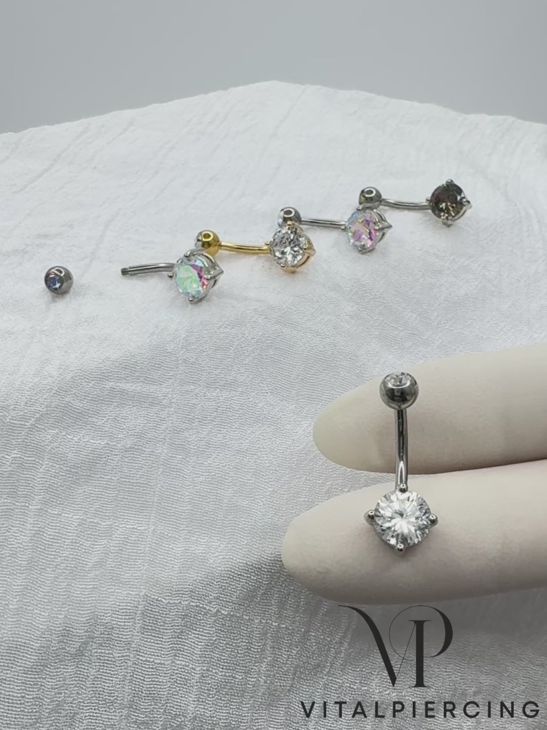 Titanium belly ring with CZ top and round brass prong-set CZ for navel piercing