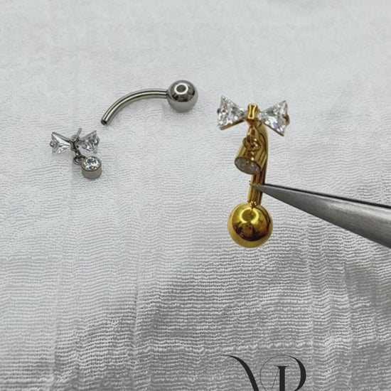 Titanium belly button ring with bowtie CZ dangle 14G curved barbell