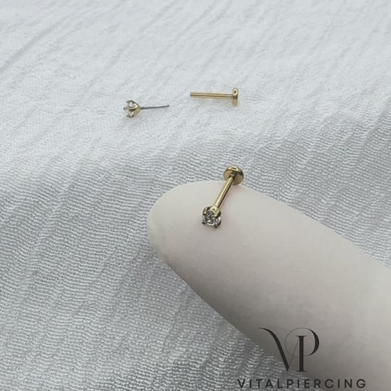 Gold titanium threadless labret with prong-set round CZ top

