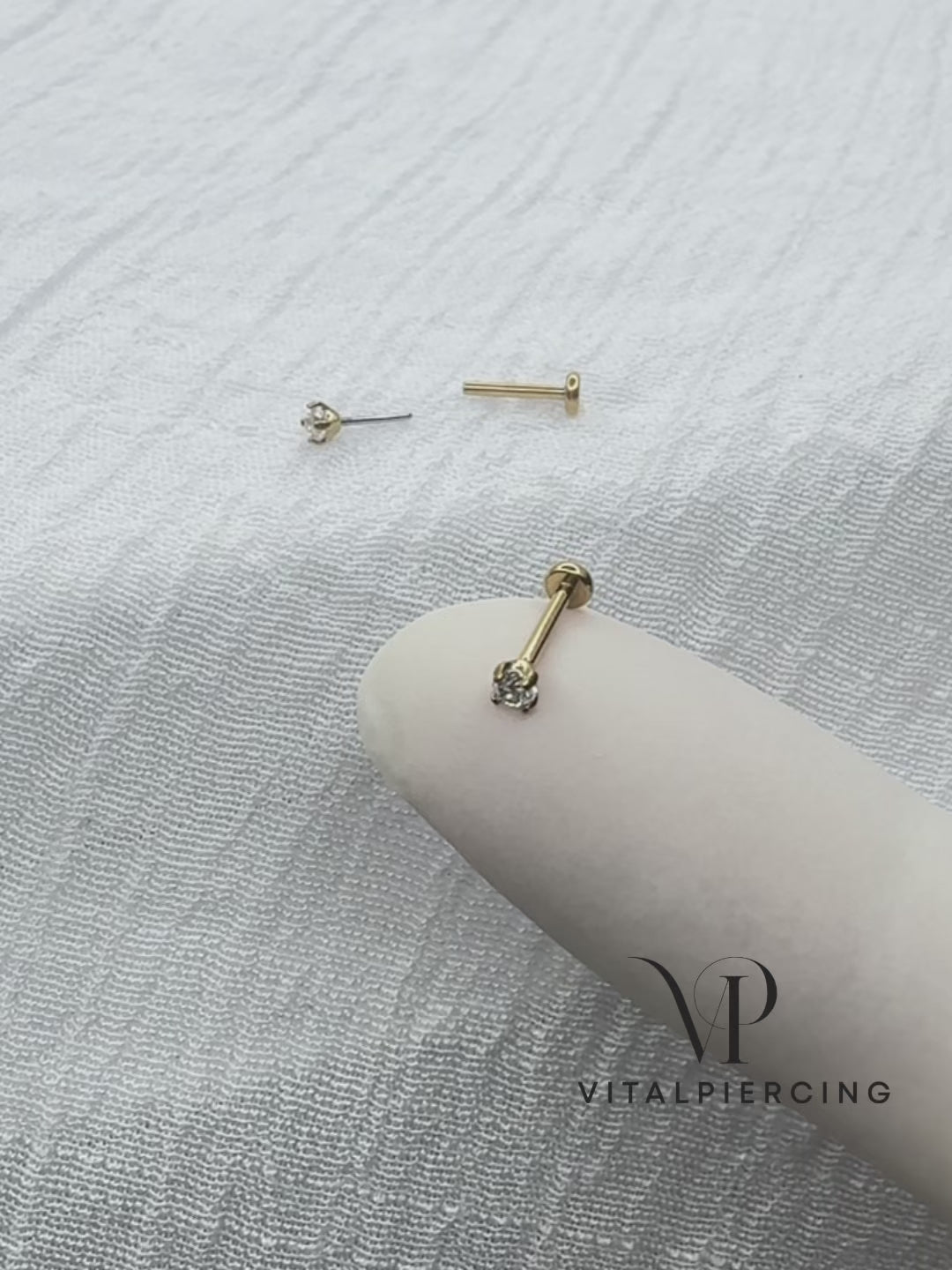 Gold titanium threadless labret with prong-set round CZ top
