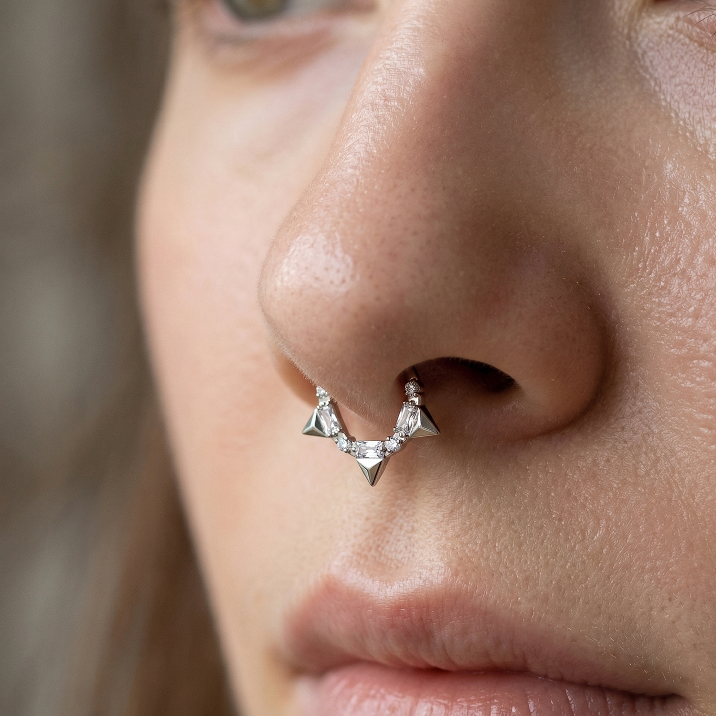 Silver titanium CZ spike hinged hoop worn as septum ring